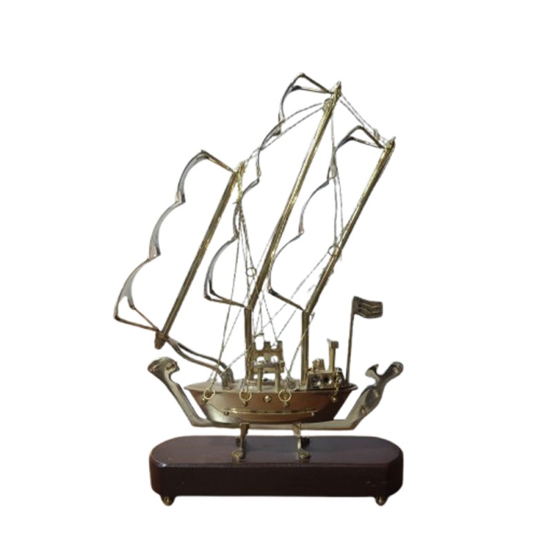 Brass crafted model of sailing ship with wooden base a showpiece for the showcase of livingroom